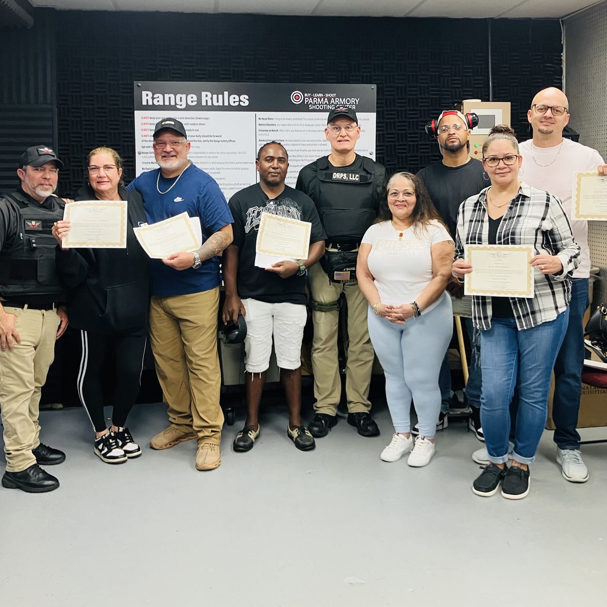 CCW class graduates holding their certificates at Parma Armory